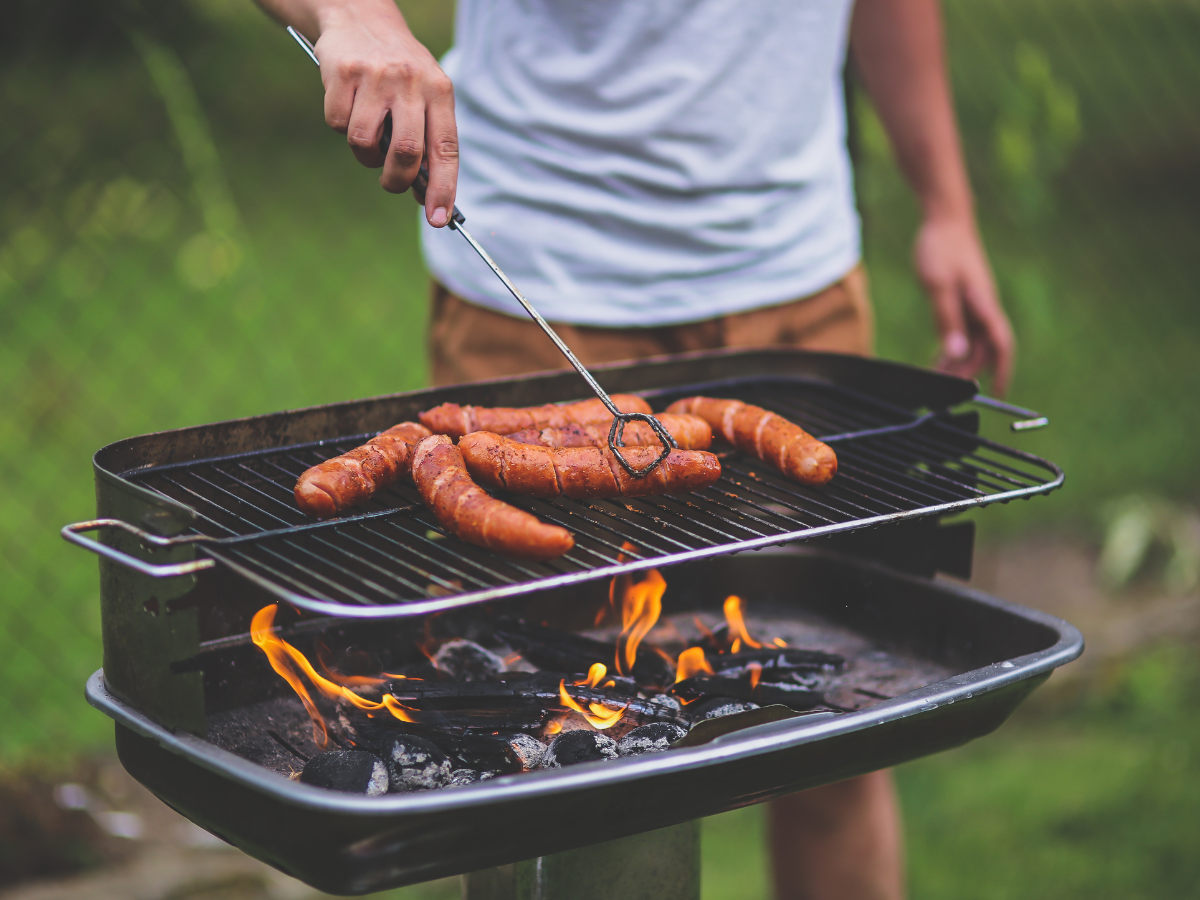 grilling meat at the park