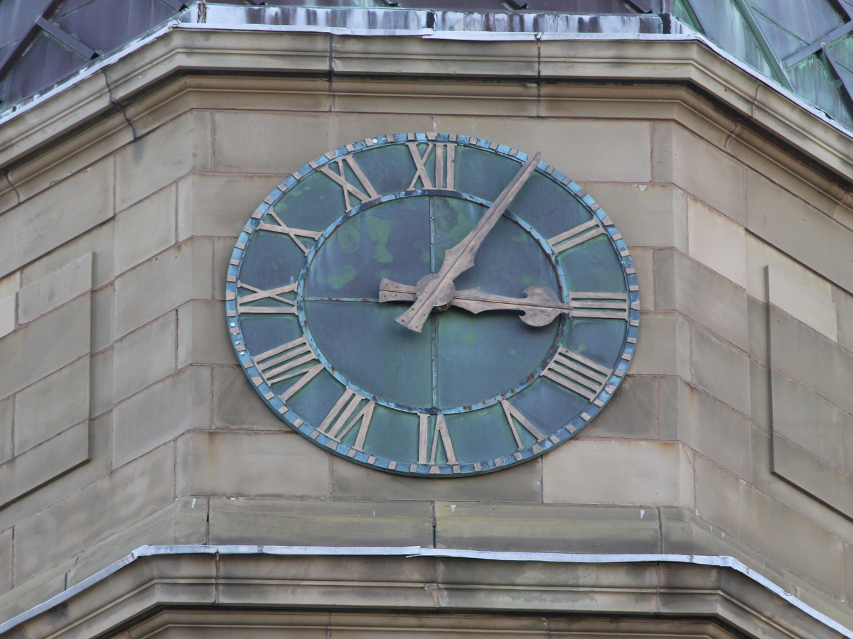 old clock on building face